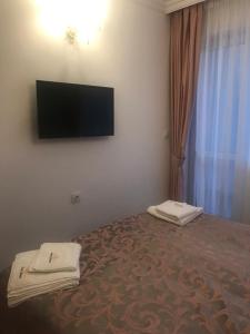 A television and/or entertainment centre at Sweet Homes 6