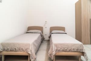 Postel nebo postele na pokoji v ubytování I Parrini