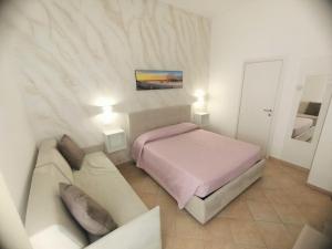 Postel nebo postele na pokoji v ubytování B&B Casa Denittis