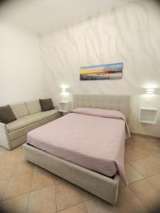 Postel nebo postele na pokoji v ubytování B&B Casa Denittis
