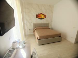 Postel nebo postele na pokoji v ubytování B&B Casa Denittis