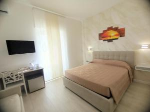 Postel nebo postele na pokoji v ubytování B&B Casa Denittis