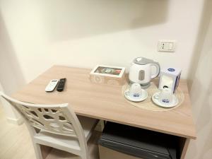 Příslušenství pro přípravu čaje a kávy v ubytování B&B Casa Denittis