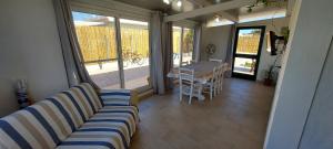 a living room with a couch and a table at Casa da Gino in Calasetta