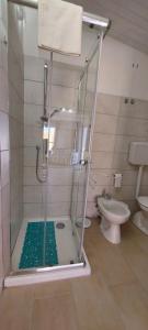 a shower with a glass door in a bathroom at Casa da Gino in Calasetta +28 photos