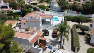 an aerial view of a house with a pool at Villa Blue Lagoon Moraira in Moraira