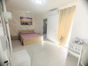 Postel nebo postele na pokoji v ubytování B&B Casa Denittis