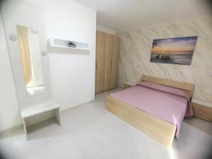 Postel nebo postele na pokoji v ubytování B&B Casa Denittis