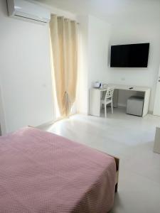 TV a/nebo společenská místnost v ubytování B&B Casa Denittis