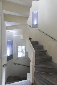 a staircase in a house with a window at Stresa Residence in Stresa