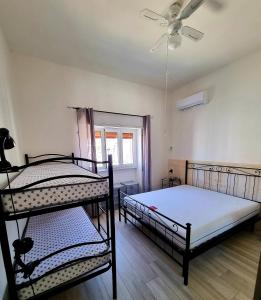 A bed or beds in a room at Le case di Pat - Casa Marea