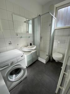 Et badeværelse på Apartment an der Weserpromenade - Schlachte - Parkplätze