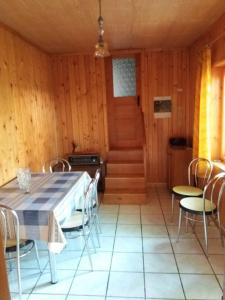 a dining room with a table and chairs at Guest House - Wai derhim in Sibiu +4 photos