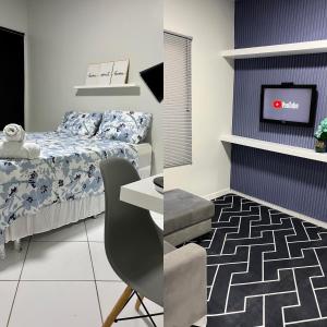 a bedroom with a bed and a tv on a wall at Apartamento em Boa Vista in Boa Vista