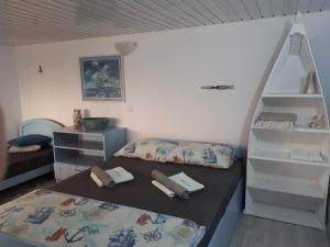 Postel nebo postele na pokoji v ubytování La Doi Pasi De Mare