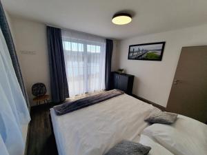 Łóżko lub łóżka w pokoju w obiekcie Apartmány Sunny hill