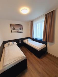 Łóżko lub łóżka w pokoju w obiekcie Apartmány Sunny hill