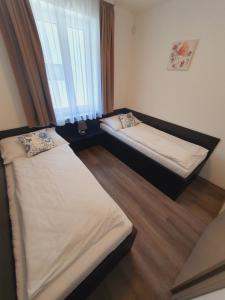 Łóżko lub łóżka w pokoju w obiekcie Apartmány Sunny hill