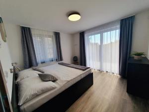 Łóżko lub łóżka w pokoju w obiekcie Apartmány Sunny hill
