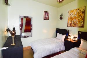 Riad Vis Ta Vie客房内的一张或多张床位