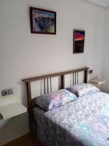 A bed or beds in a room at Apartamento CASCO HISTÓRICO