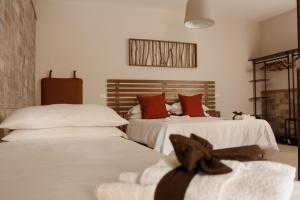 two beds sitting next to each other in a bedroom at Country House L'Aia - Wellness & Relax in Casal Velino +81 photos