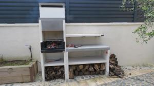 a white shelf sitting next to a wall at Escape to a spacious retreat with garden in Avinyonet de Puigventós