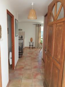 a hallway with a door leading to a kitchen at Luciana in La Croix-Valmer