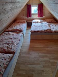 Postelja oz. postelje v sobi nastanitve Ferienhütte Zetzhirsch