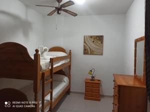 Postel nebo postele na pokoji v ubytování Apartamento ohana