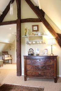 a room with a wooden dresser in a room at La Métairie des Songes in Gourdon-en-quercy +38 photos