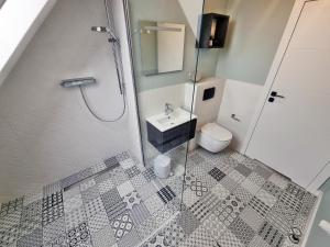 Kúpeľňa v ubytovaní Uroczy Penthouse + 17 fotografií