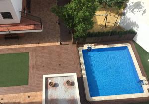 an overhead view of a swimming pool next to a building at Lara Cazorla in Cazorla