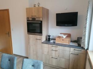 Kuchyň nebo kuchyňský kout v ubytování Ferienhaus Stoanerhof + 17 fotografií