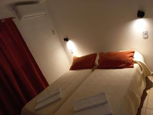 
A bed or beds in a room at Villa Ciruelos
