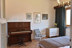 Posteľ alebo postele v izbe v ubytovaní Apartmán s klavírem