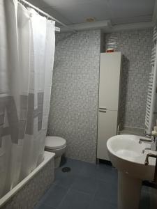 a bathroom with a toilet and a sink and a shower at Lara Cazorla in Cazorla +11 photos