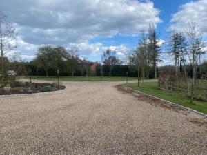 an empty road in a park on a cloudy day at Oak Bray Coach House in Bray