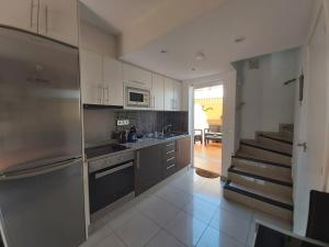 Kuchyň nebo kuchyňský kout v ubytování Fantástico Bungalow Duplex