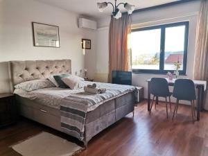Postel nebo postele na pokoji v ubytování Guest House Sunce
