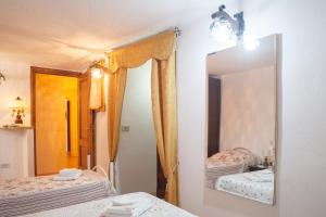 Postel nebo postele na pokoji v ubytování CASA GIULIA - Residenza Lo Sparviero