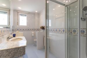 a bathroom with a shower and a sink and a toilet at Room Elciego in Elciego