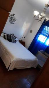 Ένα ή περισσότερα κρεβάτια σε δωμάτιο στο La casa del abuelo