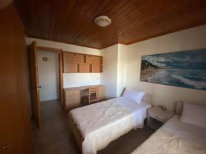 Postel nebo postele na pokoji v ubytování VILLA THEO