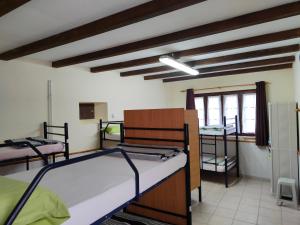A bed or beds in a room at Albergue La Senda
