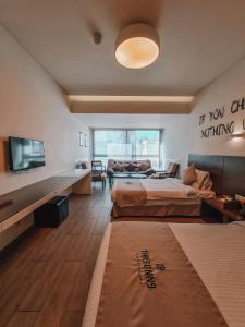 Voodi või voodid majutusasutuse Three O Nine Hotel toas