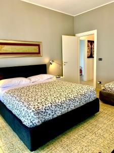 a bedroom with a large bed in a room at Maison belle Vue in Taormina