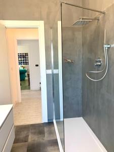 a shower with a glass door in a bathroom at Maison belle Vue in Taormina +45 photos