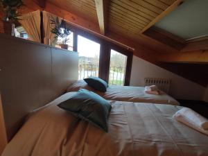 A bed or beds in a room at Allotjaments Paratge Fabas