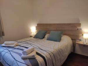 A bed or beds in a room at Allotjaments Paratge Fabas